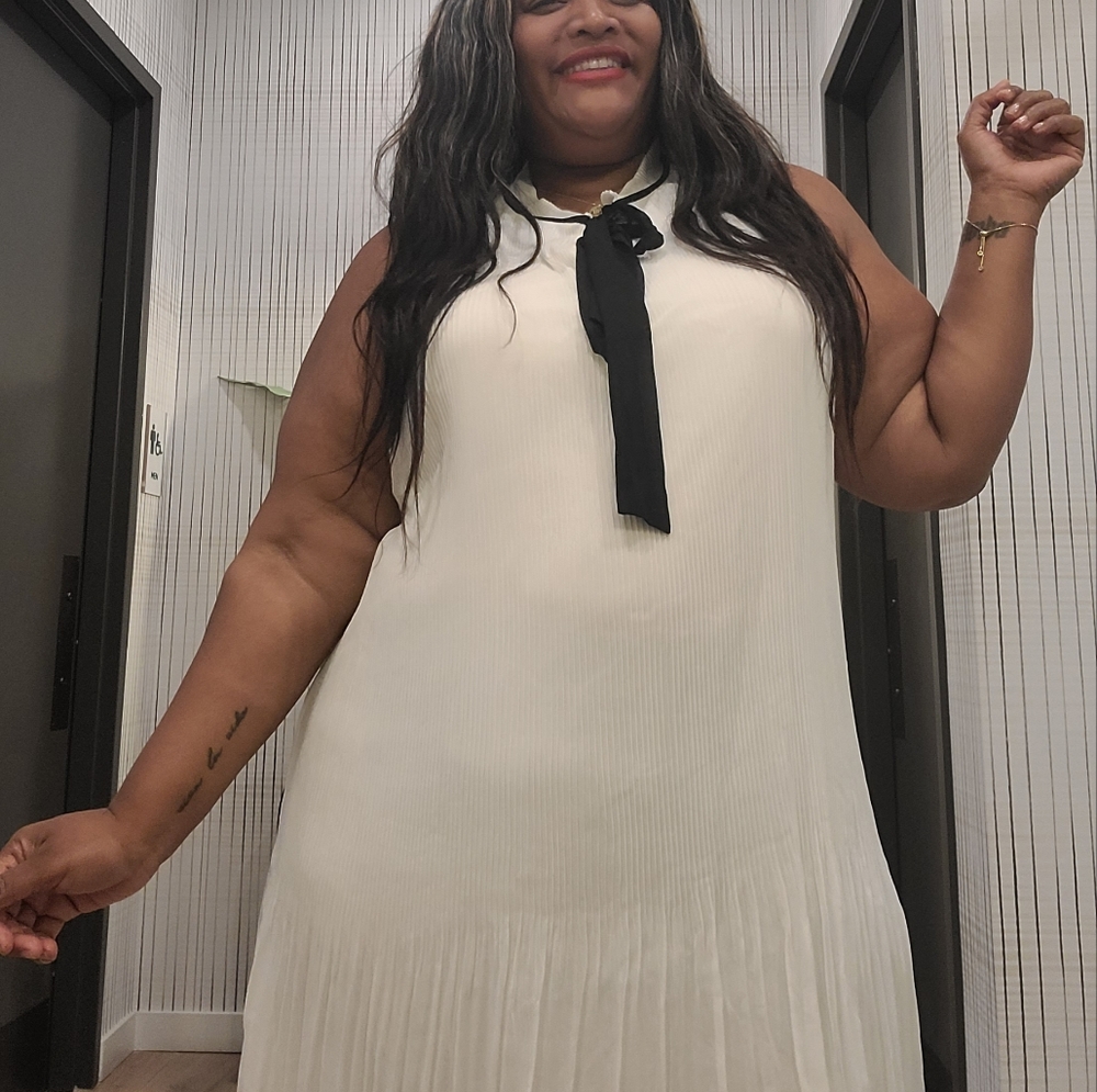Pleaded white knee length dress